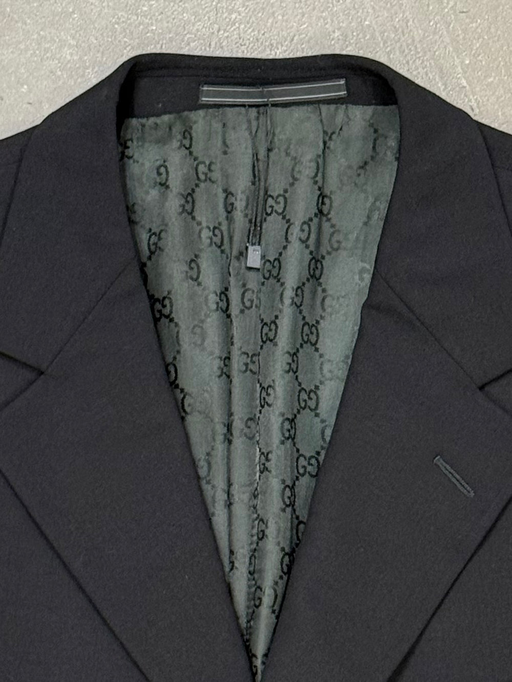 1990s Gucci by Tom Ford black wool suit with monogram lining