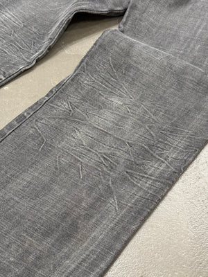 2003 Dolce & Gabbana asymmetrical heavy faded jeans