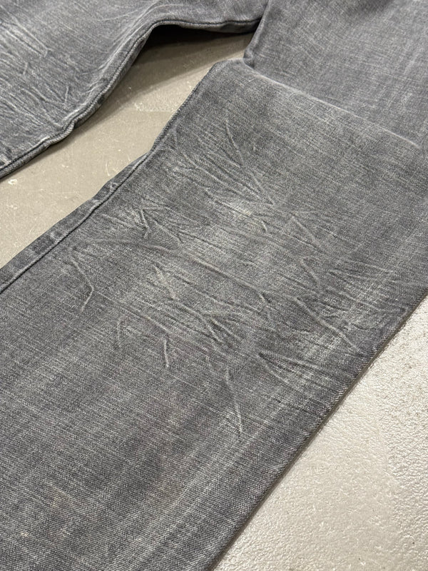2003 Dolce & Gabbana asymmetrical heavy faded jeans