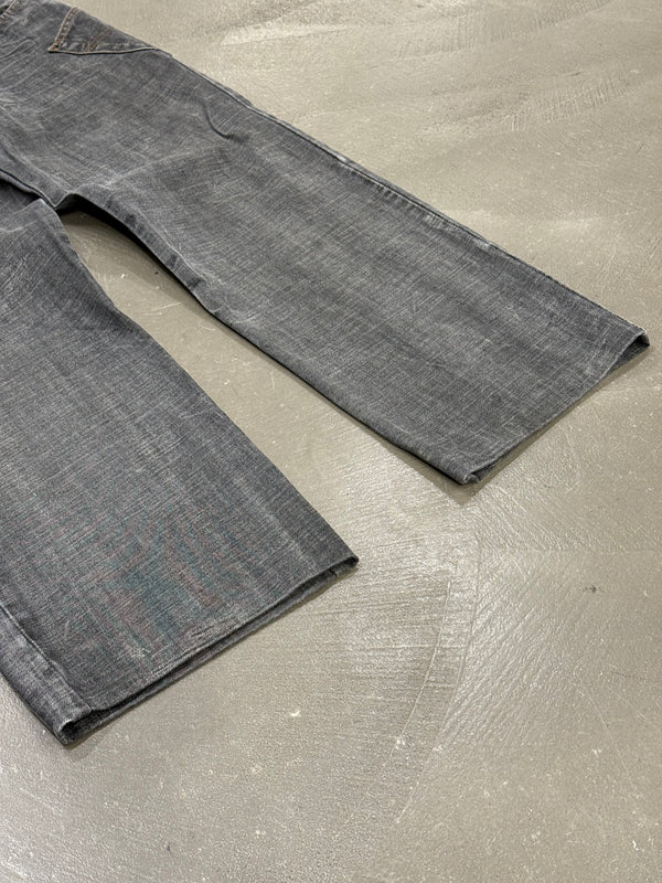 2003 Dolce & Gabbana asymmetrical heavy faded jeans