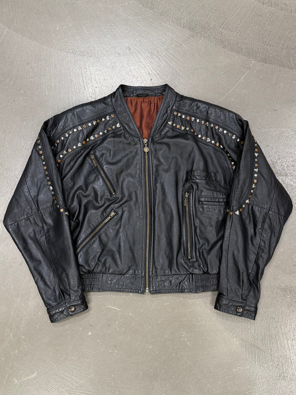 1990s Gianni Versace "Playboy" studded leather bomber jacket