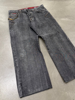 2003 Dolce & Gabbana asymmetrical heavy faded jeans