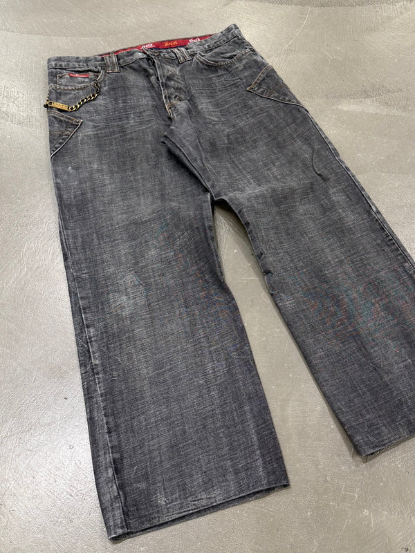 2003 Dolce & Gabbana asymmetrical heavy faded jeans