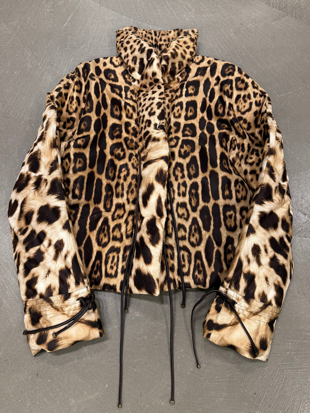 2000s Roberto Cavalli leopard print silk puffer jacket with leather straps