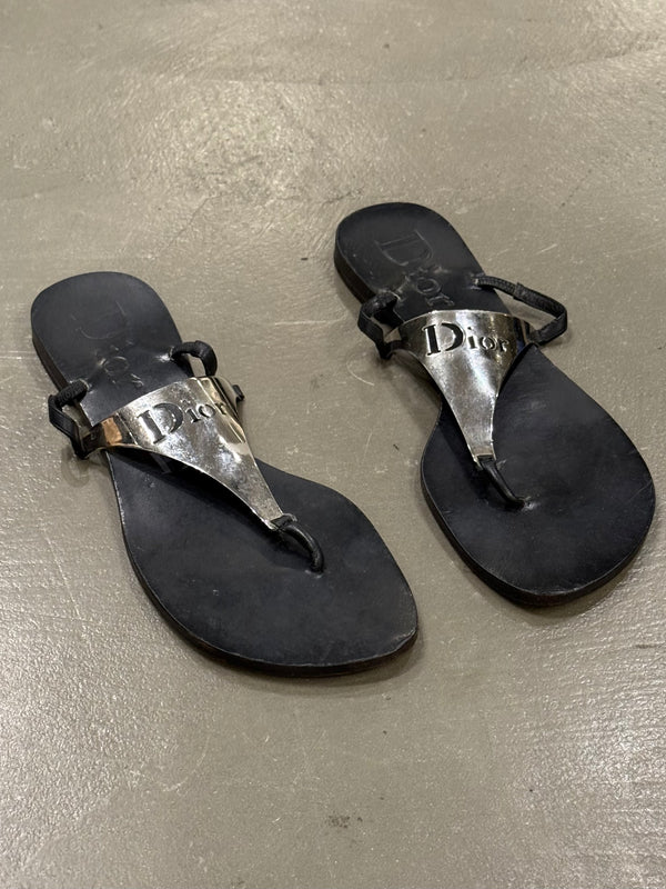 2000s Dior by John Galliano leather flip-flops with metallic plaque