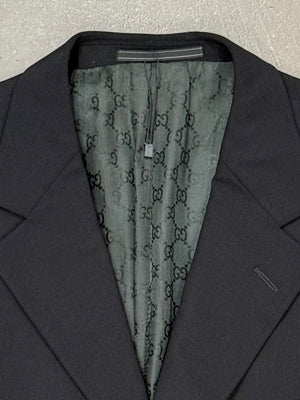 1990s Gucci by Tom Ford black wool suit with monogram lining