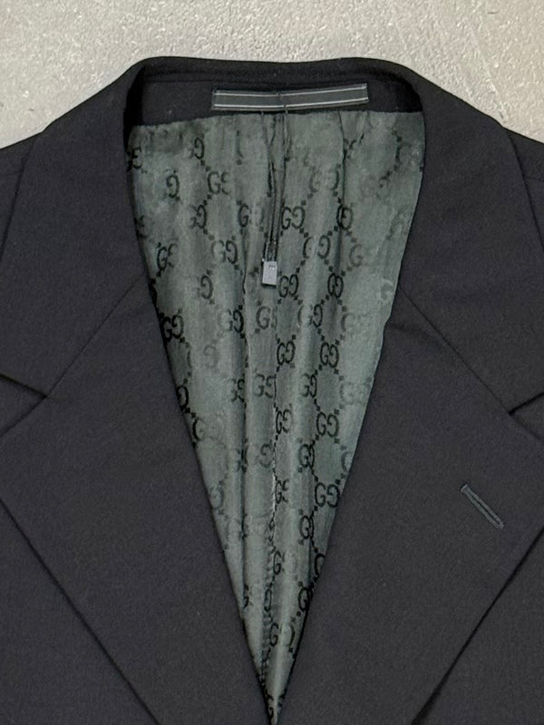 1990s Gucci by Tom Ford black wool suit with monogram lining