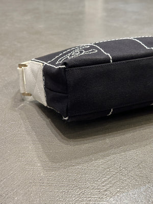 2003–2004 Chanel canvas chocolate bar bag.