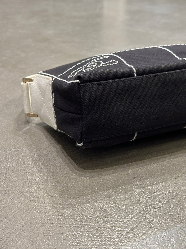2003–2004 Chanel canvas chocolate bar bag.