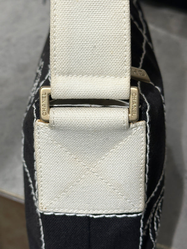 2003–2004 Chanel canvas chocolate bar bag.