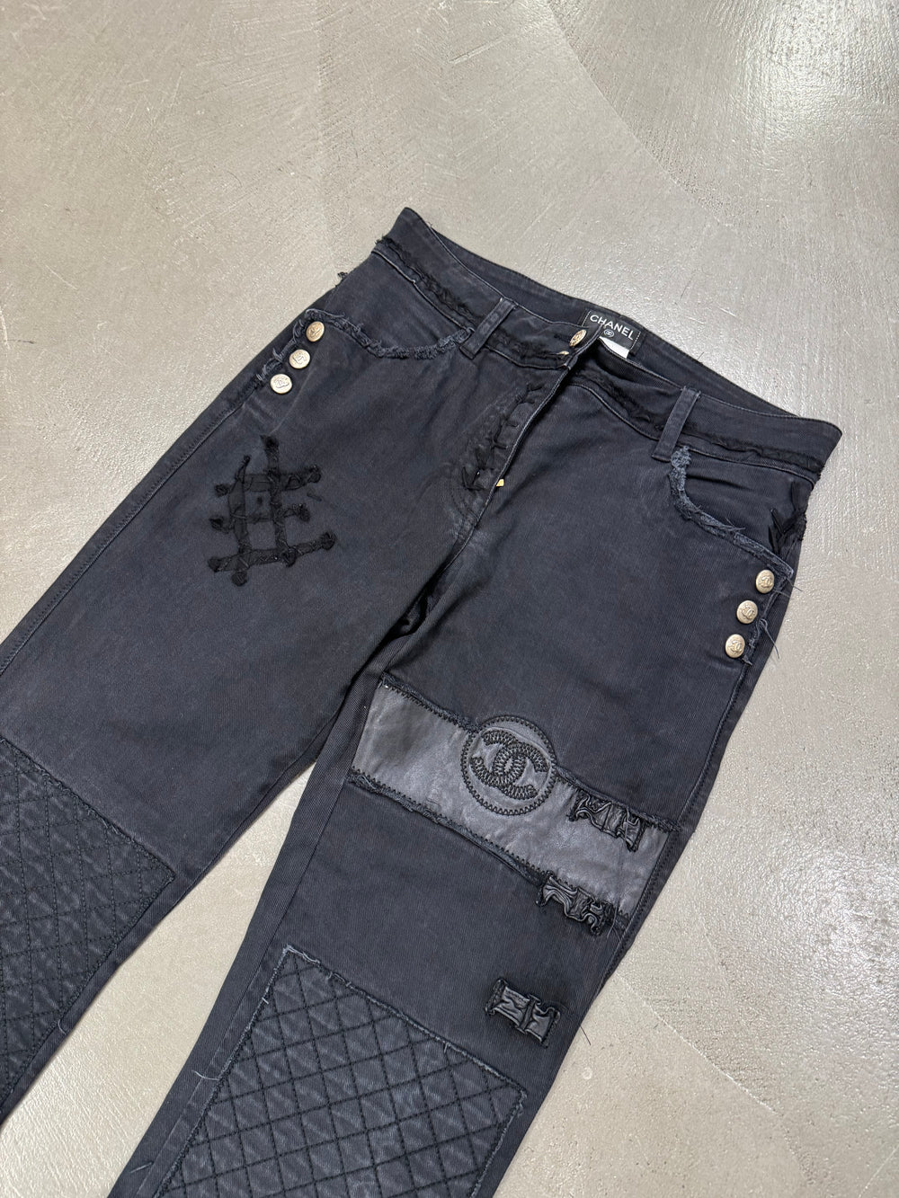 2000s Chanel black distressed patchwork jeans