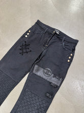 Load image into Gallery viewer, 2000s Chanel black distressed patchwork jeans
