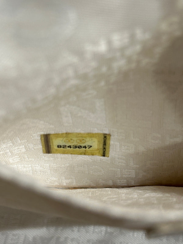 2003–2004 Chanel canvas chocolate bar bag.