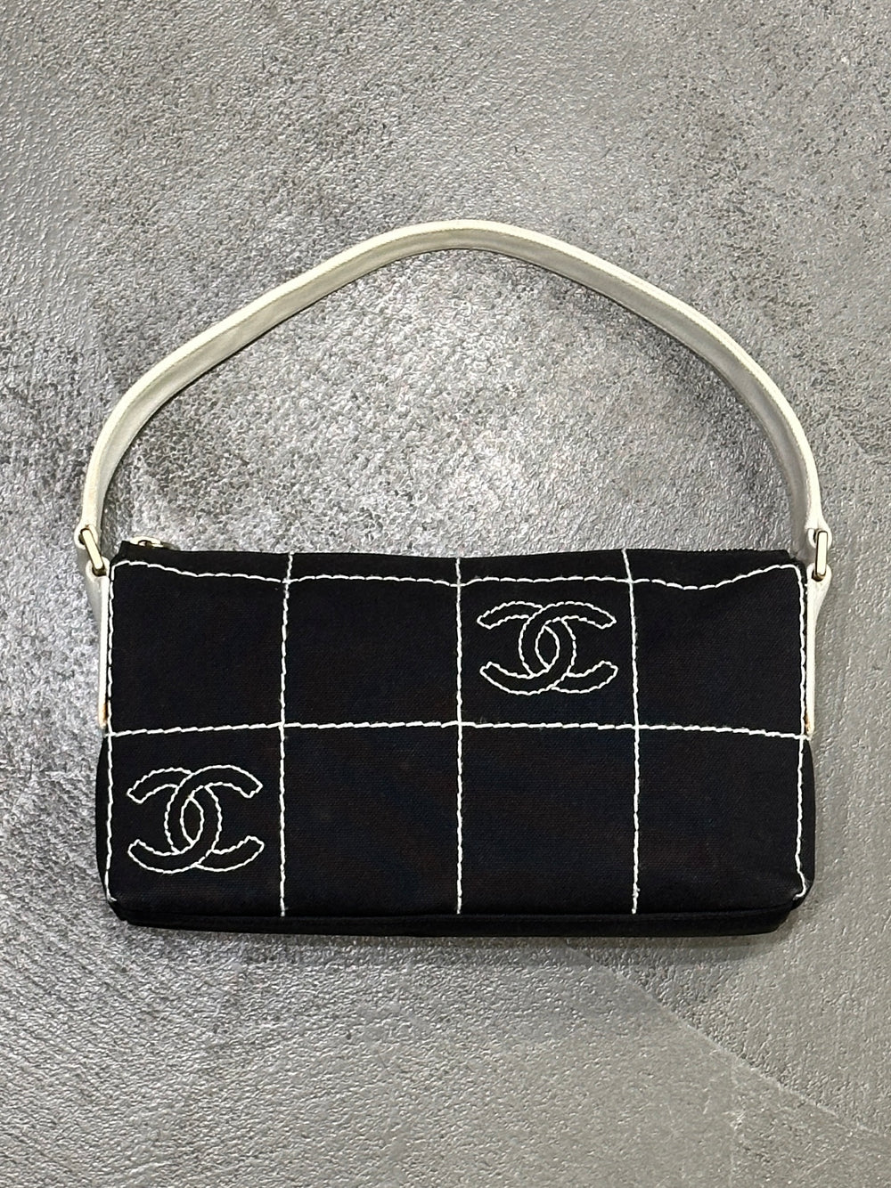2003–2004 Chanel canvas chocolate bar bag.