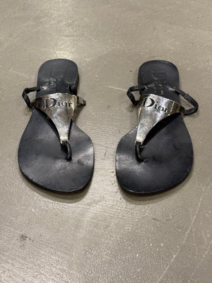 2000s Dior by John Galliano leather flip-flops with metallic plaque