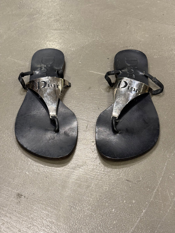 2000s Dior by John Galliano leather flip-flops with metallic plaque