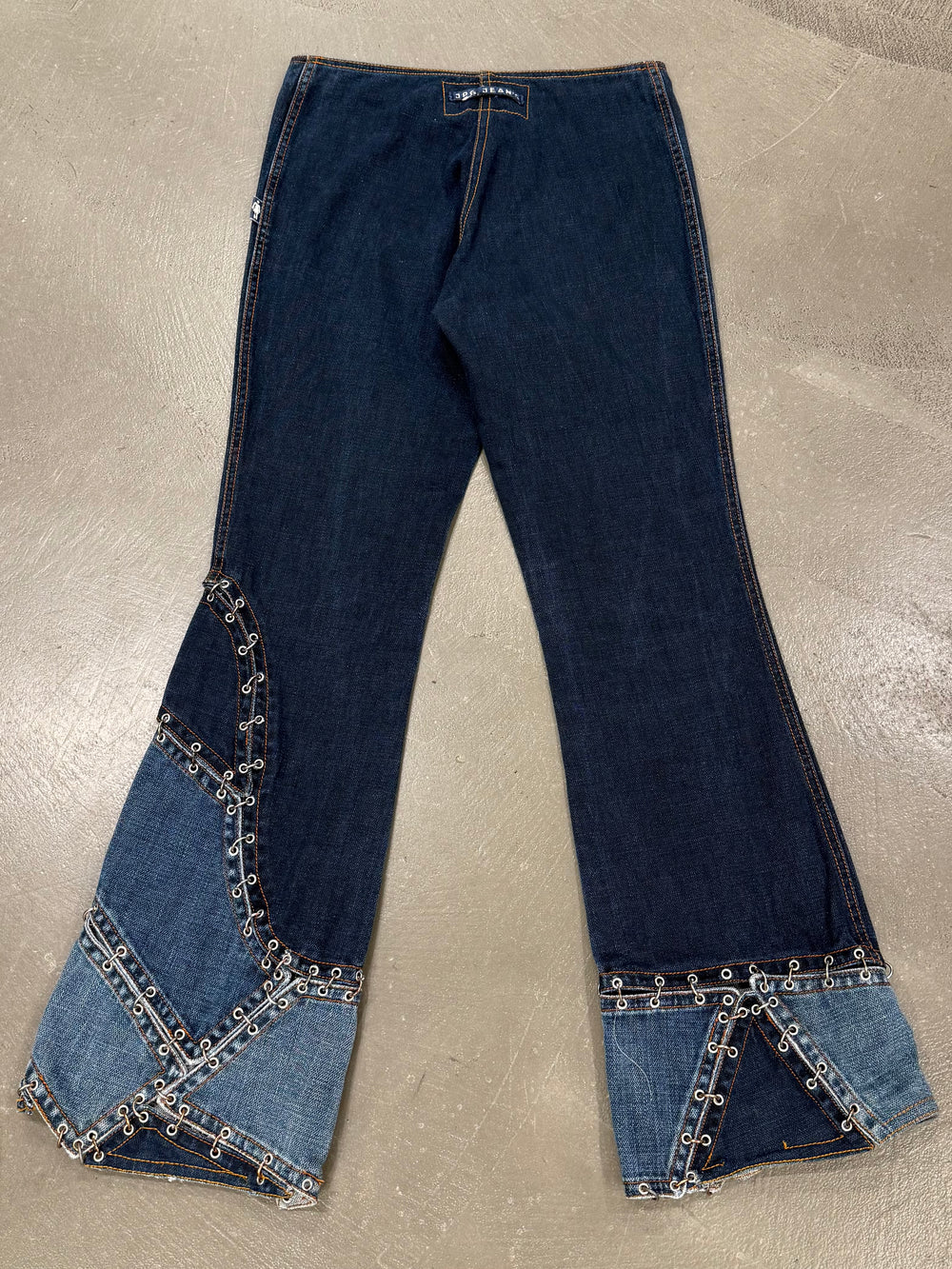 2000s Jean Paul Gaultier pierced patchwork flared jeans
