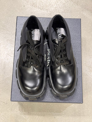 2023 Prada monolith leather/Nylon derby shoes