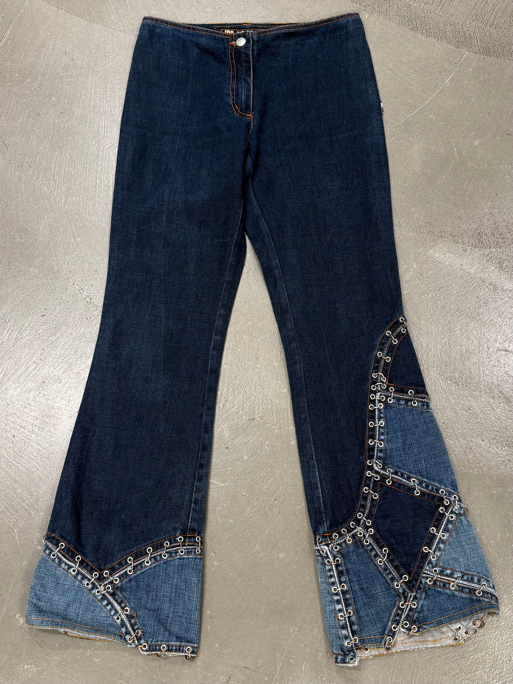 2000s Jean Paul Gaultier pierced patchwork flared jeans