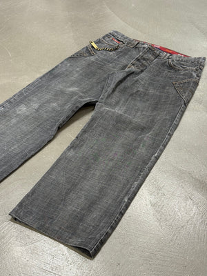 2003 Dolce & Gabbana asymmetrical heavy faded jeans
