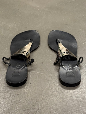 2000s Dior by John Galliano leather flip-flops with metallic plaque