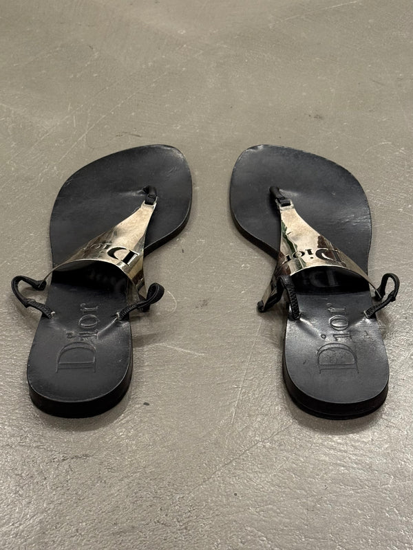 2000s Dior by John Galliano leather flip-flops with metallic plaque