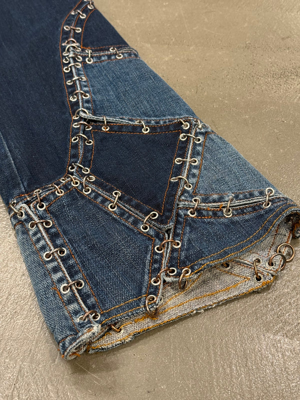 2000s Jean Paul Gaultier pierced patchwork flared jeans